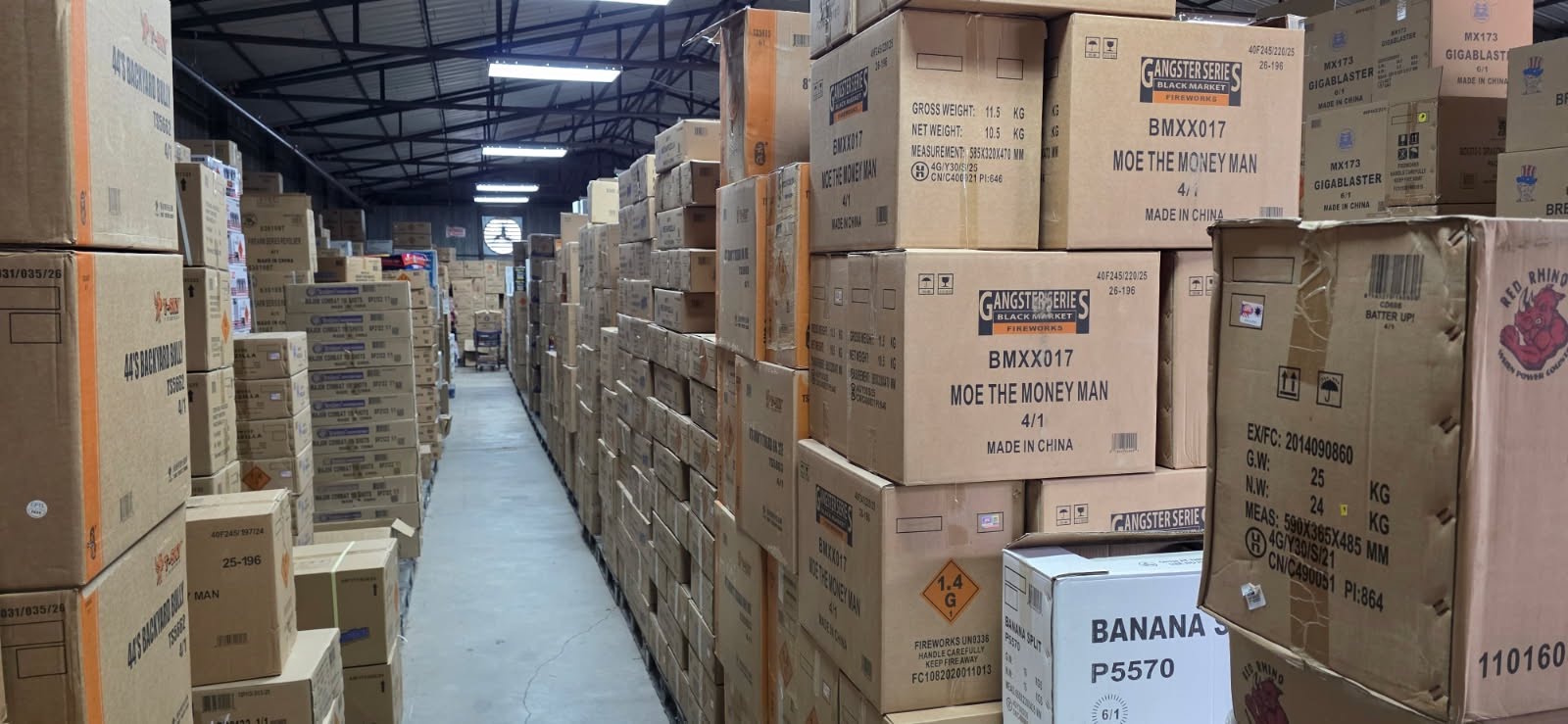 Inside the Firecracker Joe warehouse — aisles of stacked fireworks cases